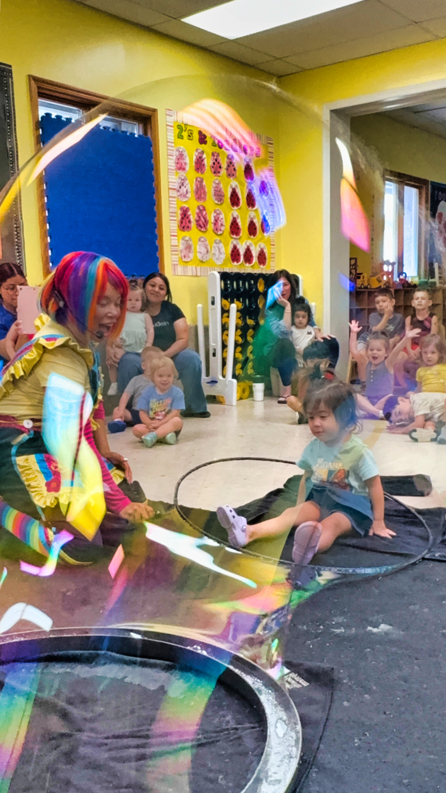 Bubble show entertainer creating giant bubble for kids at a North Jersey birthday party