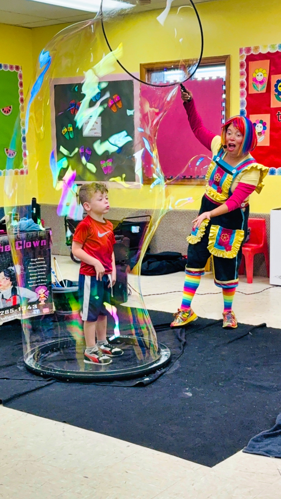 Bubble show entertainer creating giant bubble for kids at a North Jersey birthday party